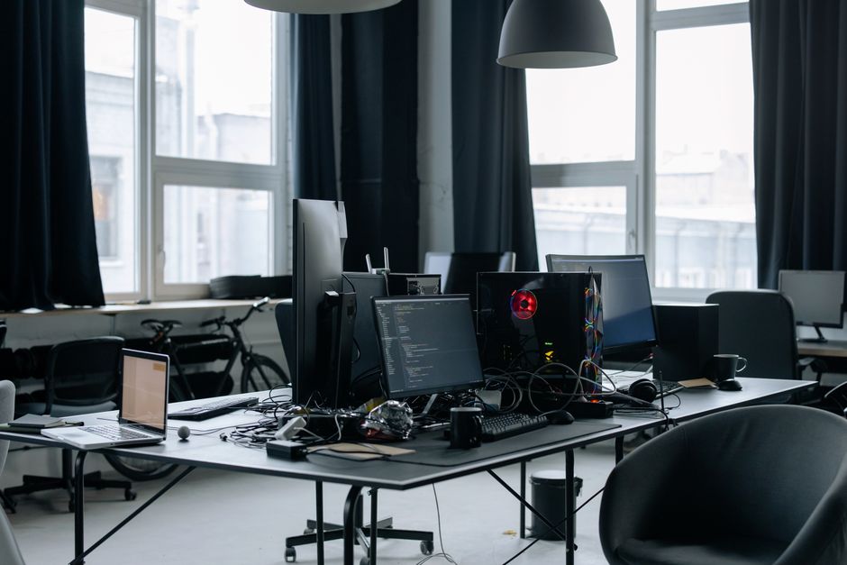 Contemporary workspace featuring computers and coding screens